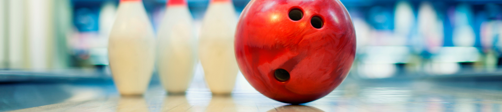 Bowling ball and pins in bowling alley