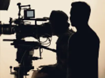 Person behind a film camera