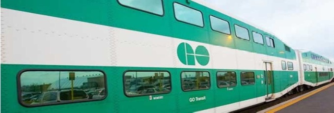 Side view of a green GO train 