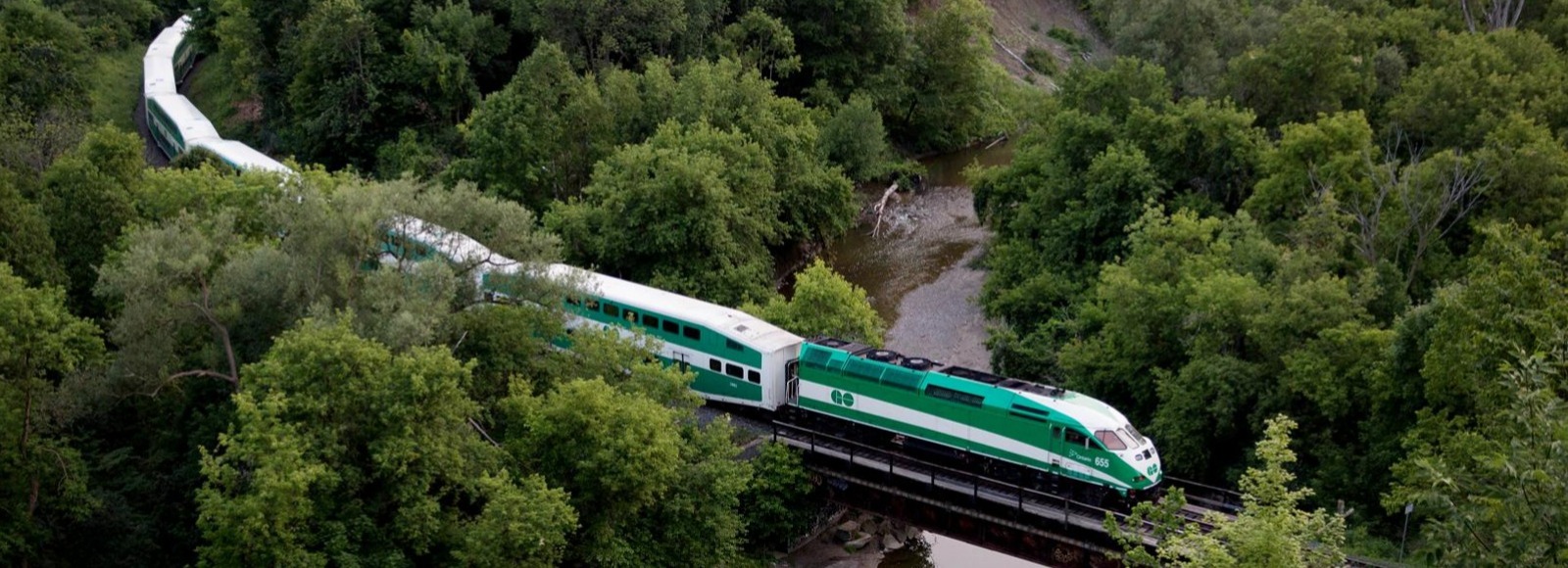 View of GO train passing over bridge