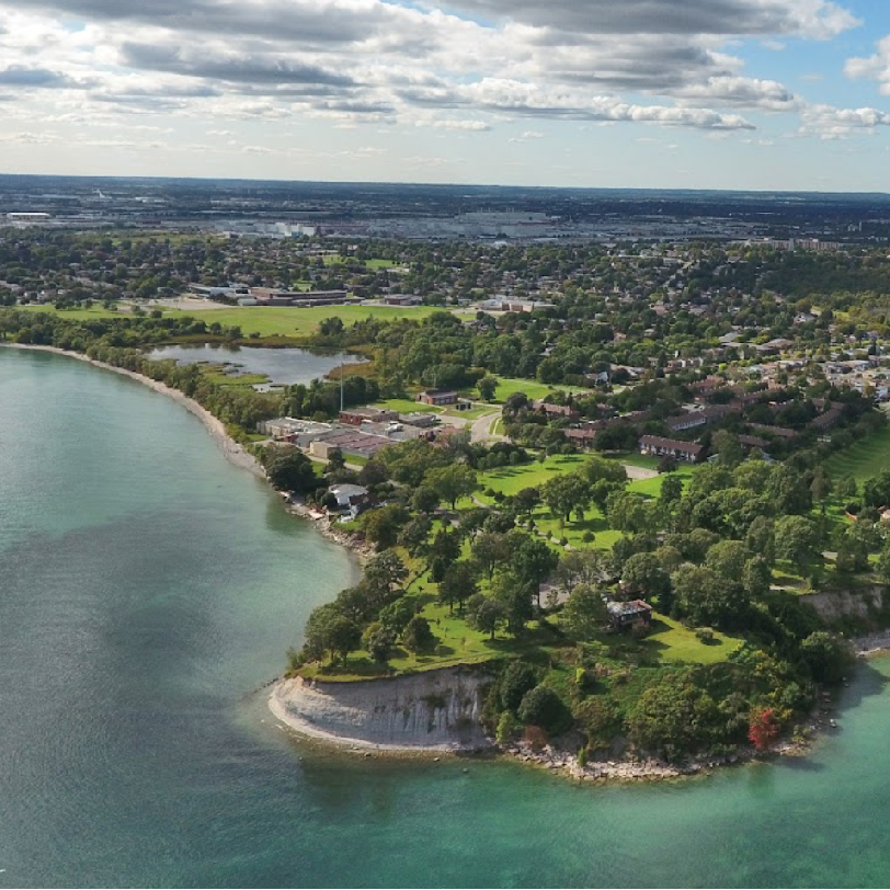 View of Oshawa from Lake Ontario from an aerial view, showing the greenspace and city skyline 