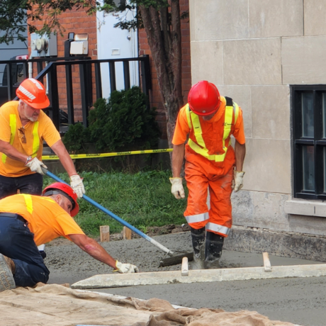 City skilled labourers laying cement