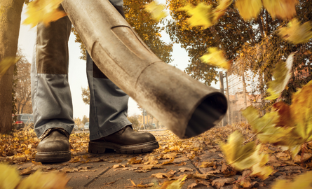 worker using leaf blower