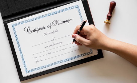 signing marriage certificate