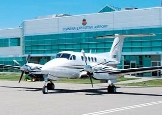 airplane in front of airport