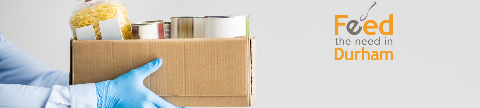 Box of food and the Feed the Need Durham logo
