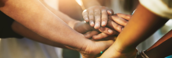 Hands creating a team