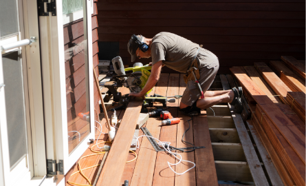 person building a deck