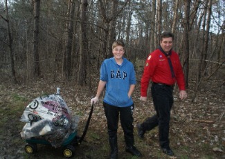 teens with garbage bags in a wagon