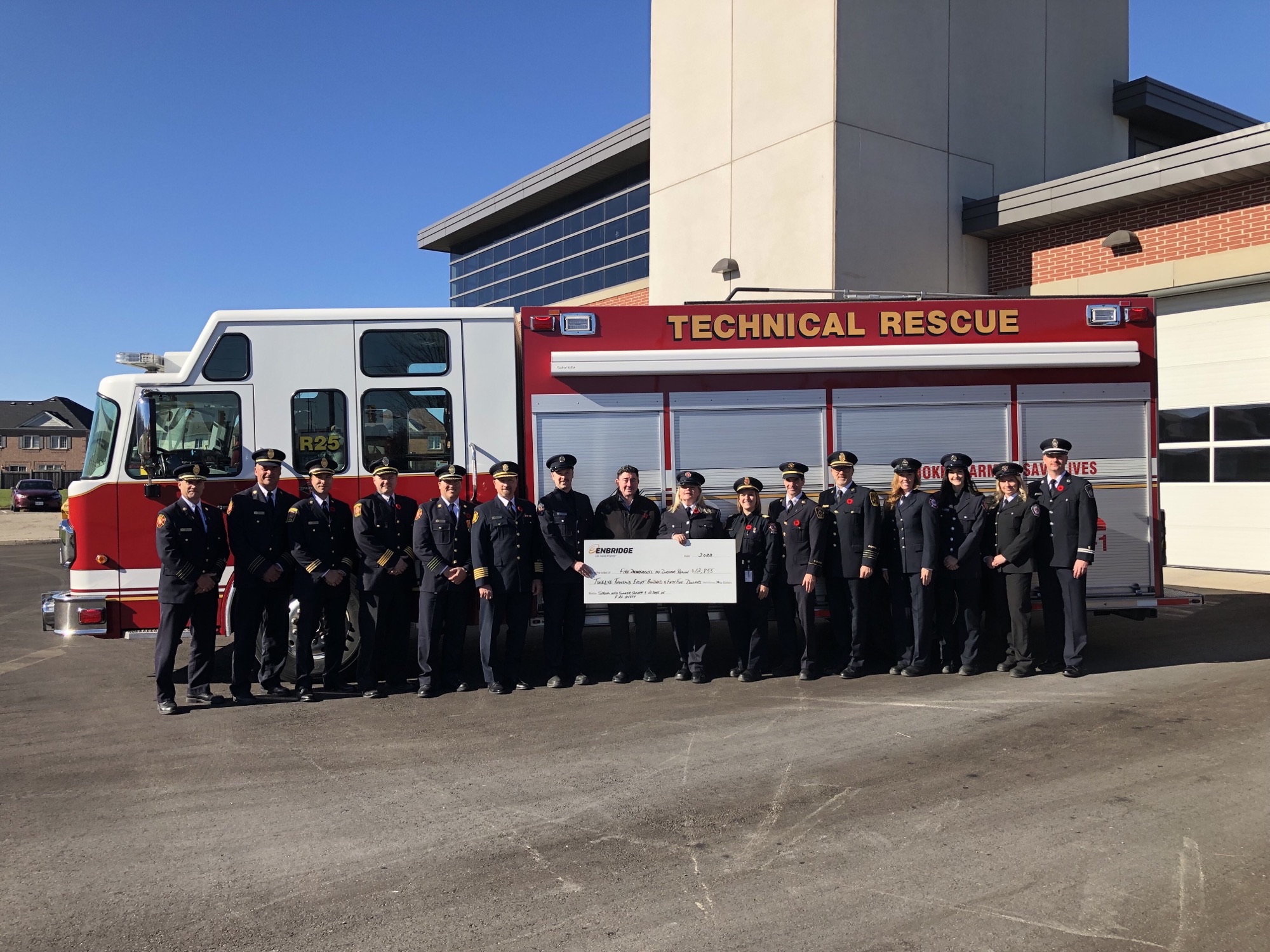 Regional Fire Services representatives receiving a cheque from Enbridge Gas