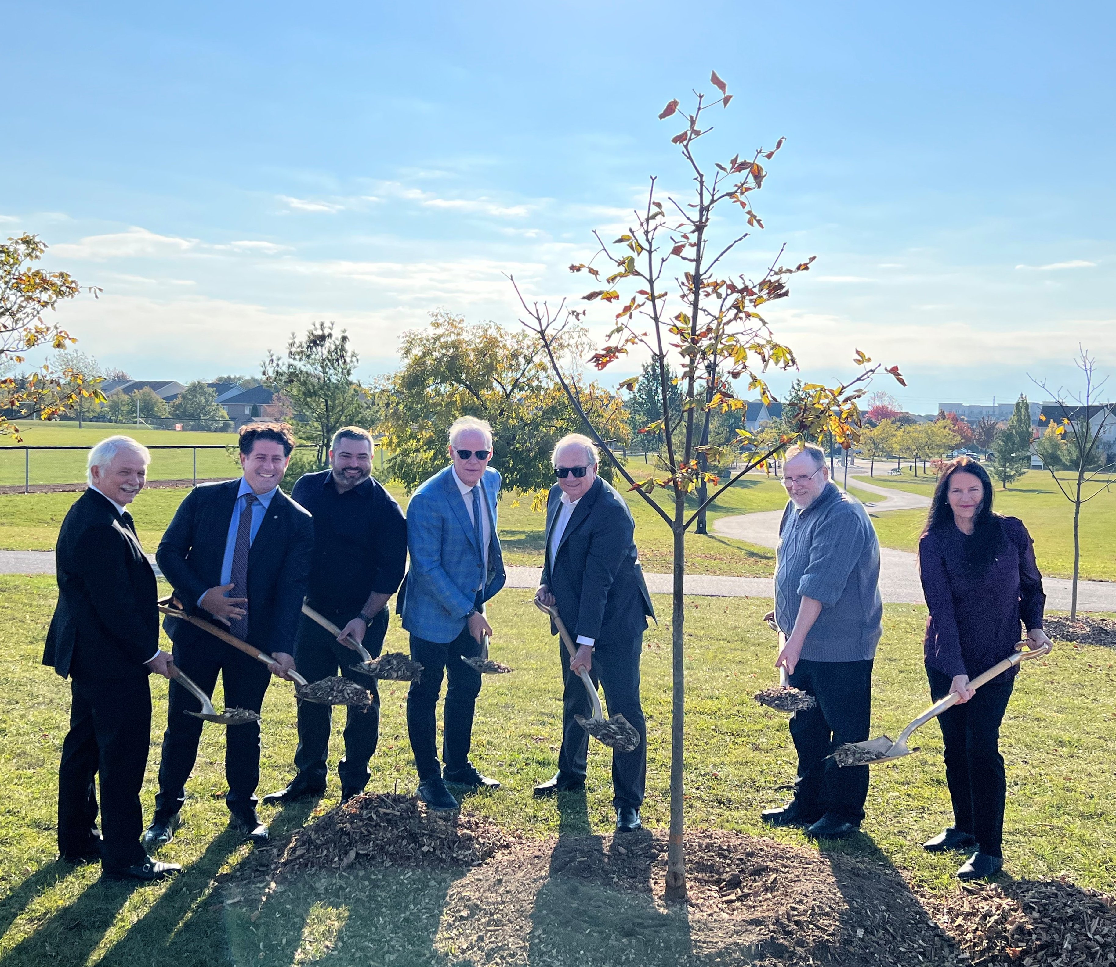 Members of Oshawa City Council and representatives from CN took part in a ceremonial tree planting at Coldstream Park to celebrate a donation from the CN Stronger Communities Fund. 