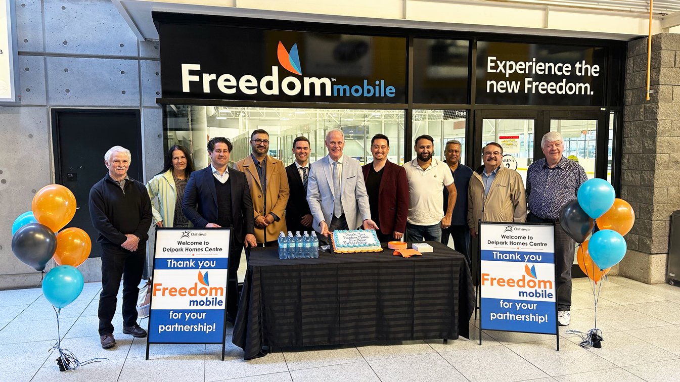 Members of Oshawa City Council joined Freedom Mobile representatives to celebrate the three-year naming rights sponsorship of Arena 2 at Delpark Homes Centre.