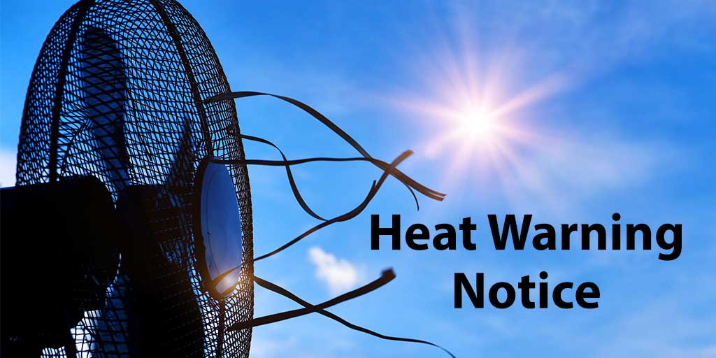 Fan blowing with blue sky behind