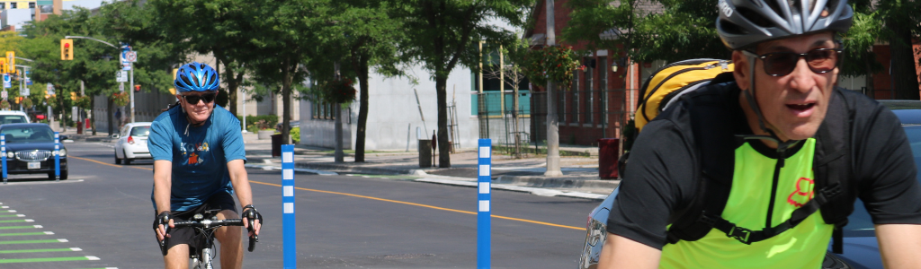 cyclists travel along the Athol St. cycle tracks in Oshawa