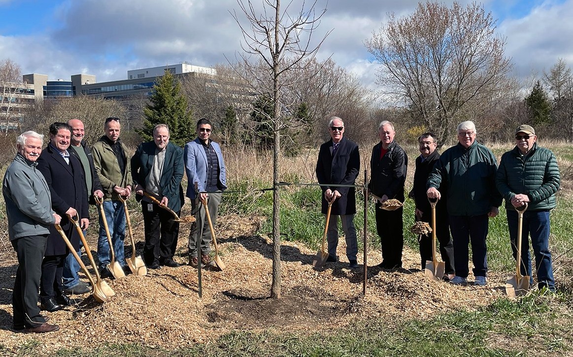 members of City Council and representatives of GM Canada and Friends of Second Marsh at a tree planting ceremony 