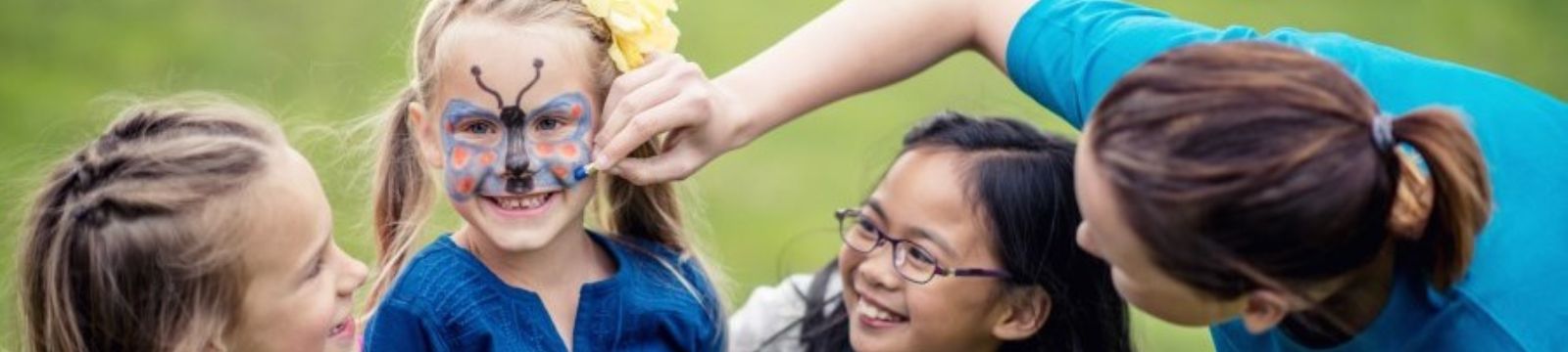 Girl with drawing of butterfly on face