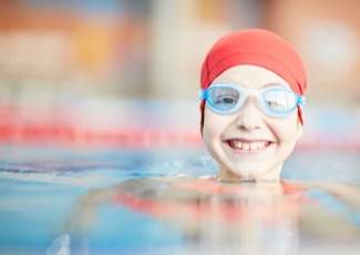 girl in swim cap in pool