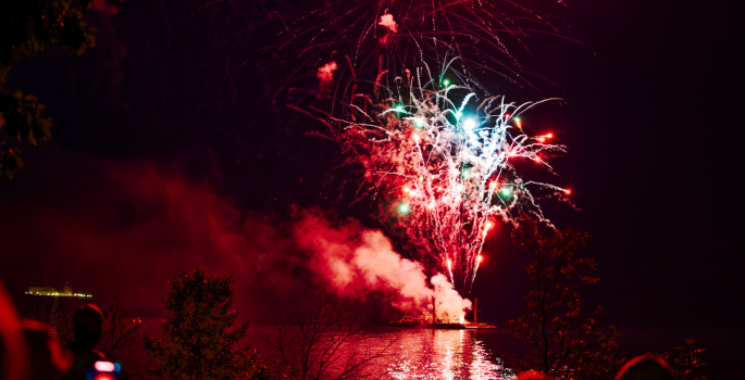 red and white fireworks from barge