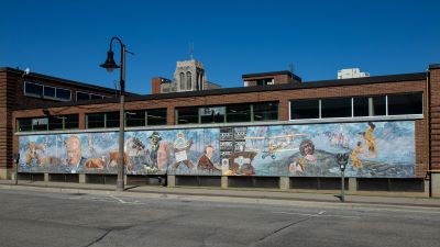  This mural depicts Camp X and the skills learned there as well as famous faces involved in Camp X, such as Winston Churchill and William "Bill" Hardcastle.