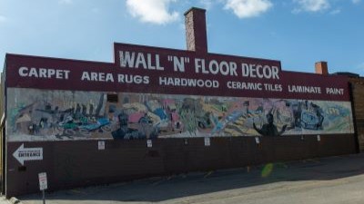 This mural depicts the evolution of Oshawa's automobile industry.