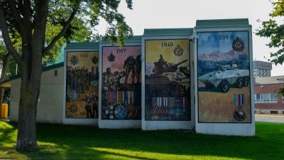  The mural is comprised of four panels depicting battles the Ontario Regiment were involved in from 1866 to 1994.