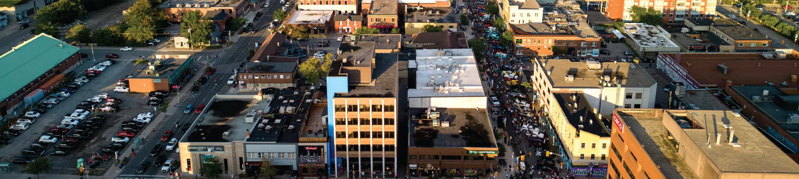 Satellite image of downtown Oshawa in daytime, streets and buildings with cars on roadway.