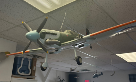 Oversize model airplane hanging from ceiling within 420 Wing Oshawa.