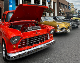 classic red car with hood open