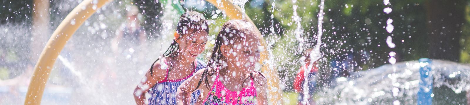 Children playing in water at splash pad