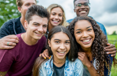 Teens smiling in a park