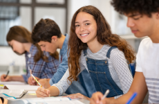 Teen smiling in a classroom