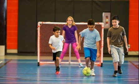 Kids playing indoor soccer