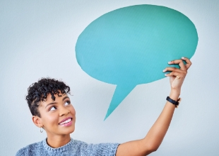 person holding a speech bubble