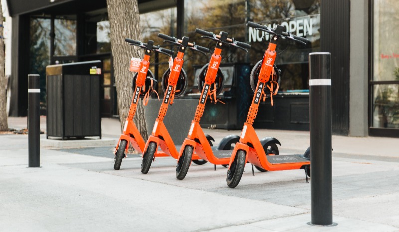 Neuron Mobility escooters parked on sidewalk