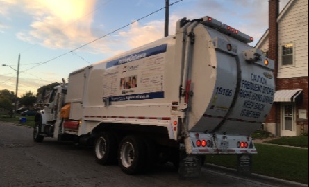 Curbside waste collection truck