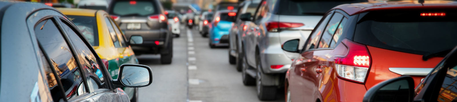 two lanes of traffic moving along the roadway