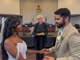 Couple with officiant