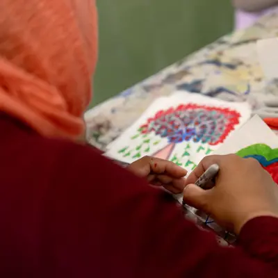 A woman drawing a heart