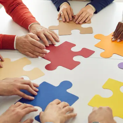 people putting a puzzle together