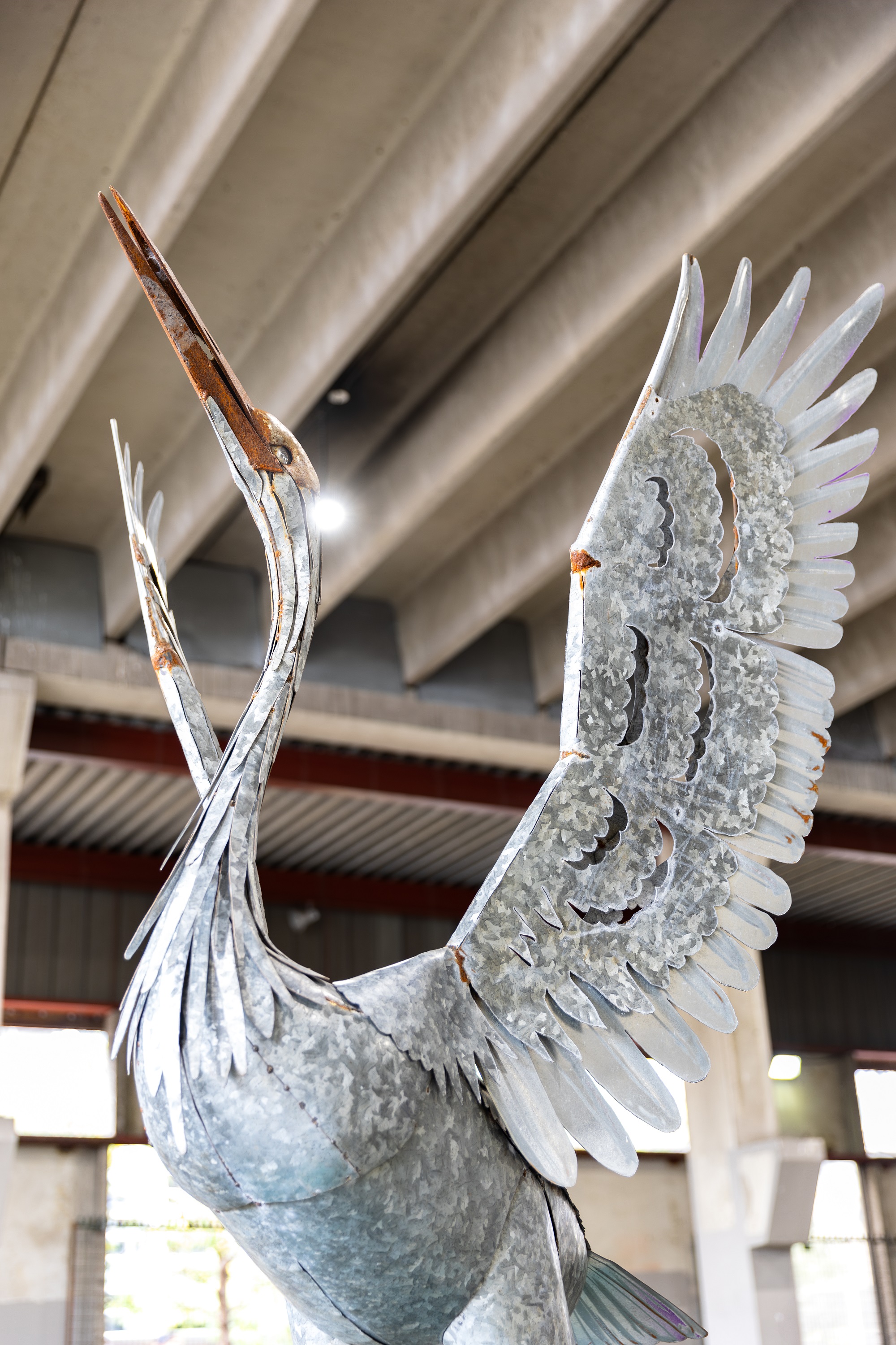 Metal sculpture of a heron by Geordie Lishman titled Inspiration Taking Flight