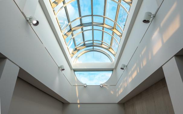 interior view of ceiling glass windows in art gallery