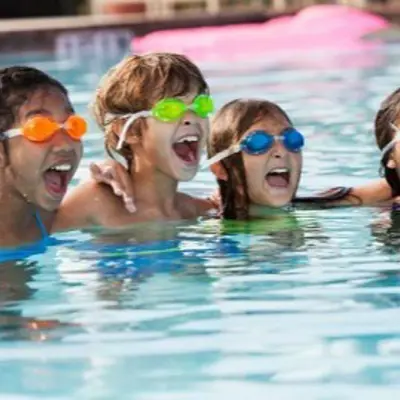 Youth swimmers wearing swim goggles