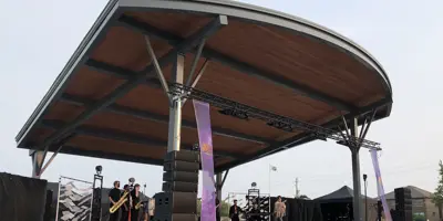 A band performing on the stage at Ed Broadbent Waterfront Park