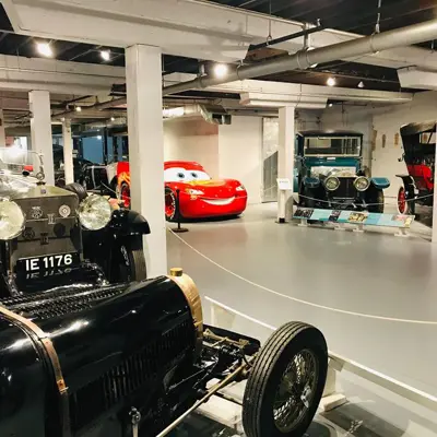 museum cars on display including Lightning McQueen