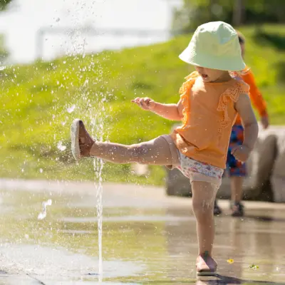 Child enjoying a splash pad