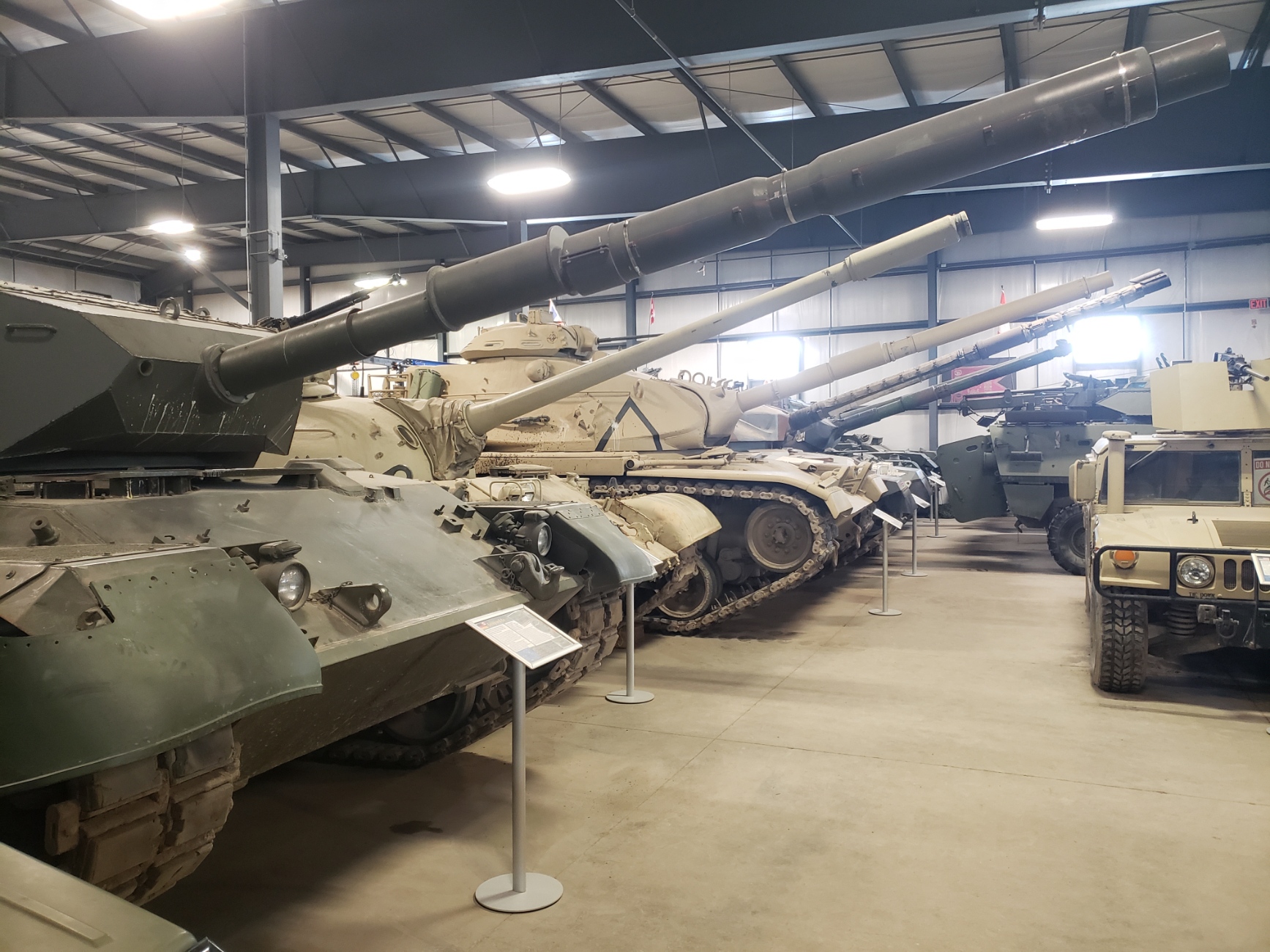 Tanks inside hangar on display