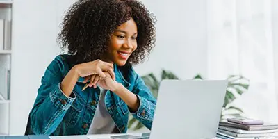Person sitting at a computer looking at the screen