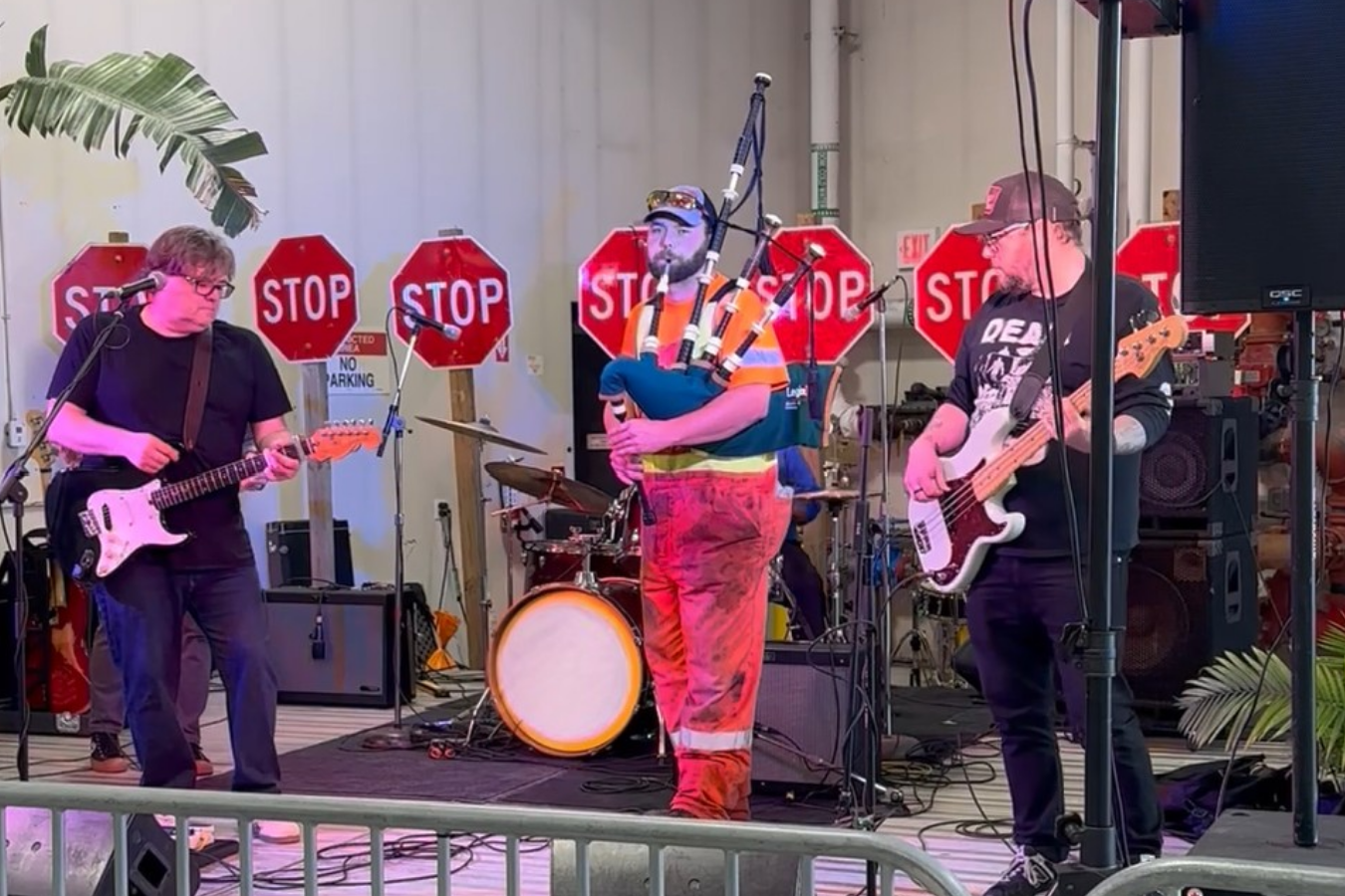 Band performing on stage with instruments