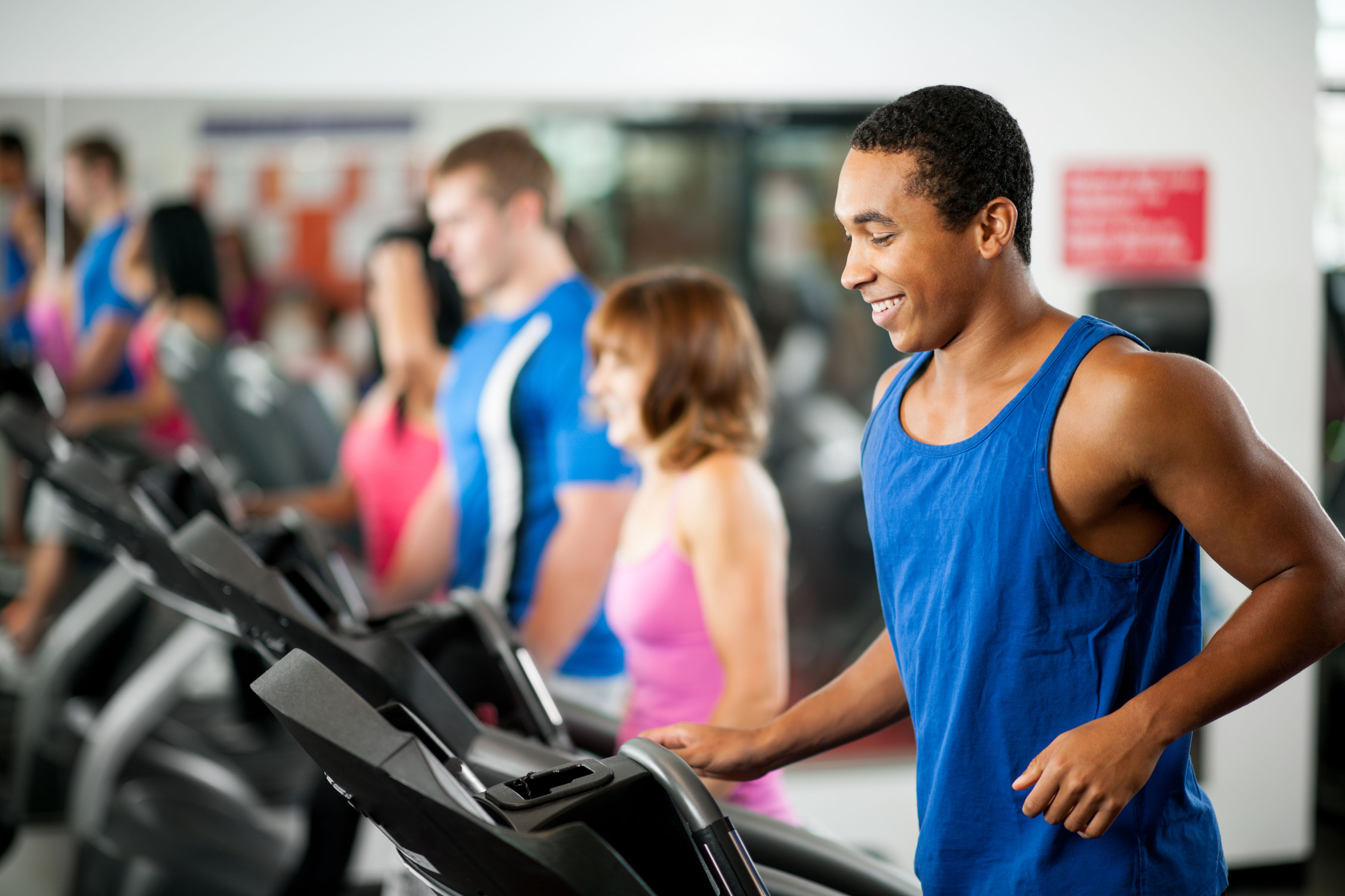 Man in Fitness Centre running on treadmill