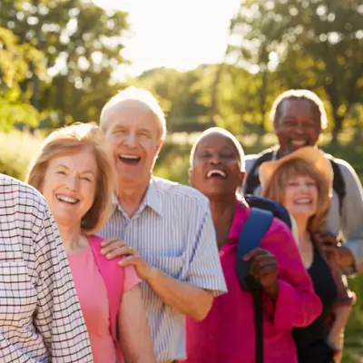 seven seniors hiking and smiling
